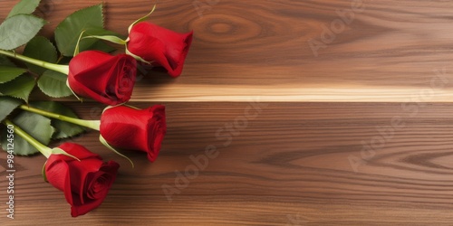 red roses on a wooden table