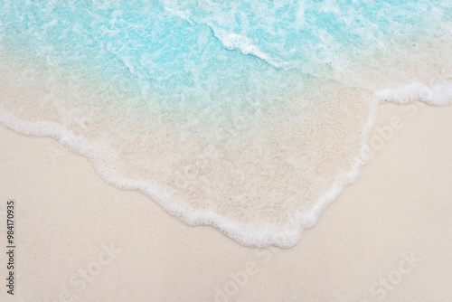 Fototapeta Naklejka Na Ścianę i Meble -  wave on luxury white sand beach, top view, closeup