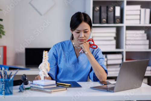 Headache stress, nurse or doctor asian woman in hospital feeling pain, tired or sick. Healthcare, wellness or female medical physician with depression or burnout while working late on laptop

