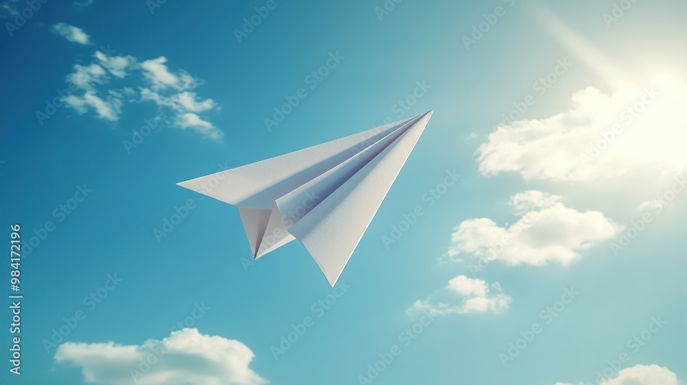 A paper airplane soaring through a clear blue sky with fluffy clouds. A paper airplane soaring through a clear blue sky with fluffy clouds.