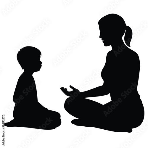 mother and son silhouette sitting in pose lotuses and watching to each other, talking