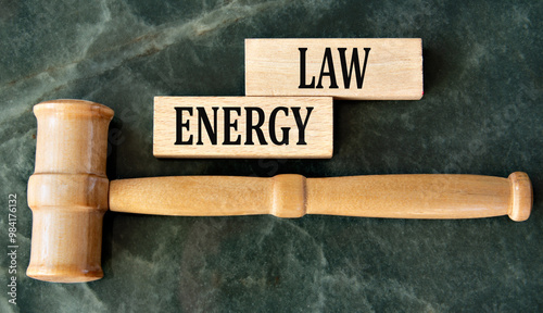 ENERGY LAW - words on wooden blocks on a green background with a judge's gavel photo