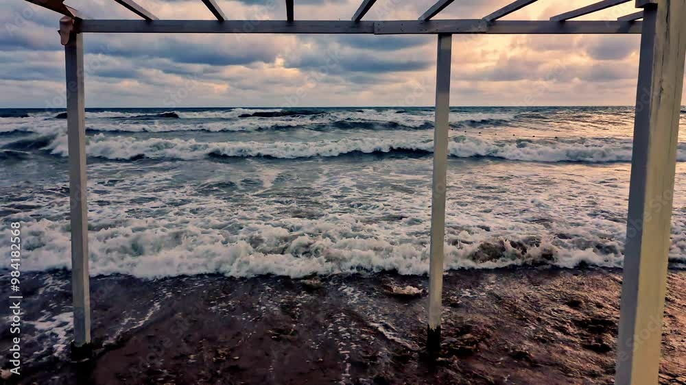 Ocean Cumulus Rain Gray Purple Clouds Yellow Sunset Sky Waves Horizon Slide Camera Slow Motion. Sea Waves and Beautiful Evening Sky. Planet, Travel, Nobody. Ocean Cumulus Rain Gray Purple Clouds Yellow Sunset Sky Waves Horizon Slide Camera Slow Motion. Sea Waves and Beautiful Evening Sky. Planet, Travel, Nobody.
