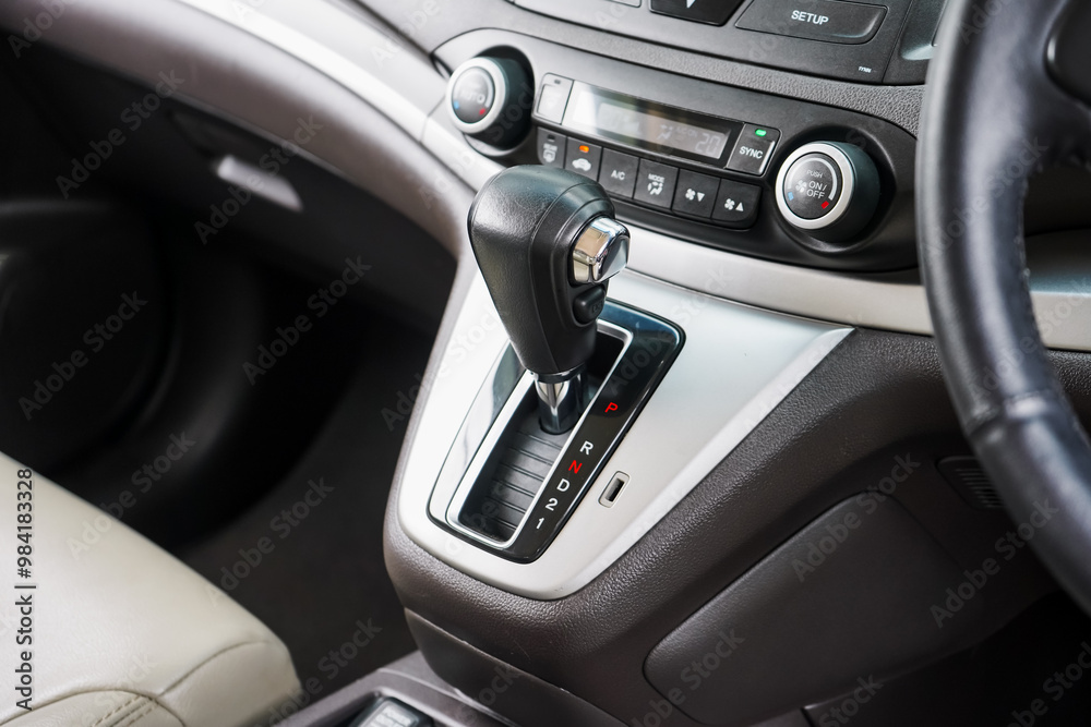 automatic transmission shift selector in the car interior. Closeup a manual shift of modern car gear shifter. 4x4 gear shift automatic transmission shift selector in the car interior. Closeup a manual shift of modern car gear shifter. 4x4 gear shift