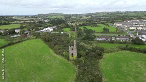 Camborne, Cornwall, England: DRONE VIEWS: The drone shows two abandoned tin mine wheelhouses. Camborne dates from 1181AD and was formerly one of the richest tin mining areas in the world (Clip 1). photo