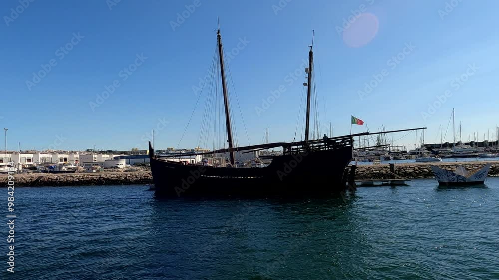 Traditional dark-hulled Portuguese boat 
