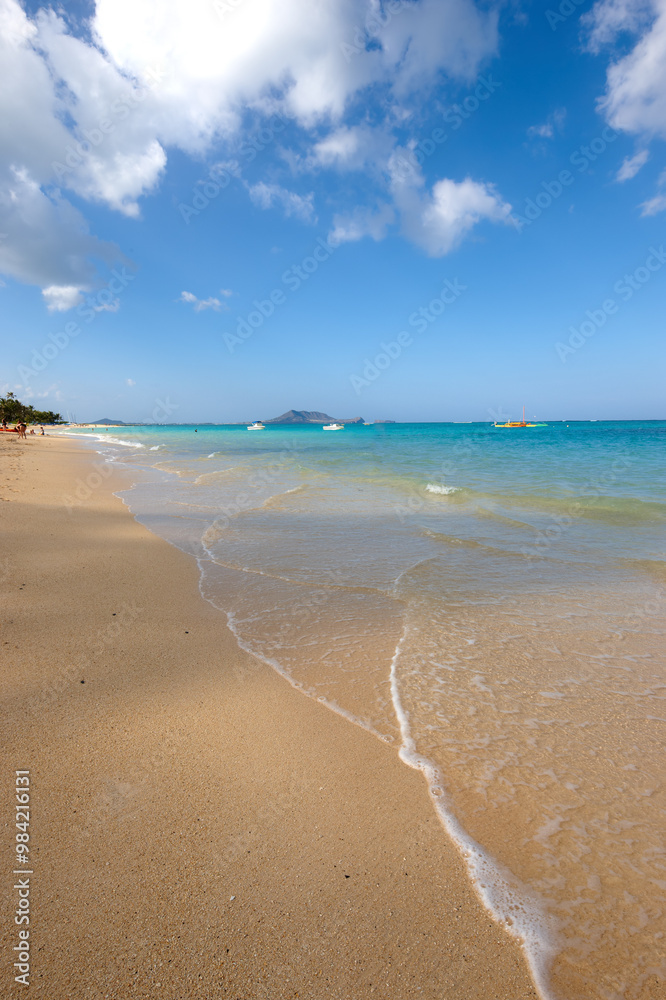 Fototapeta premium Beach, shoreline or island with sand, blue sky or paradise for vacation or environment to relax. Brazil, harmony or outdoor view of water, sea or ocean in Rio de Janeiro with destination for travel