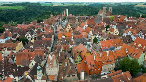 4K Aerial Drone Video of Historic Town Hall and Iconic Gothic St. Jakobskirche Church in Downtown Rothenburg, Germany photo