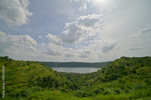 Faraway view of Lonar crater lake under cloudy skies, Maharashtra, India.