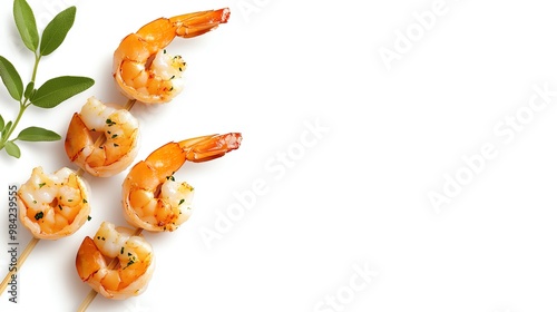 Grilled shrimp skewer garnished with basil, isolated on white background