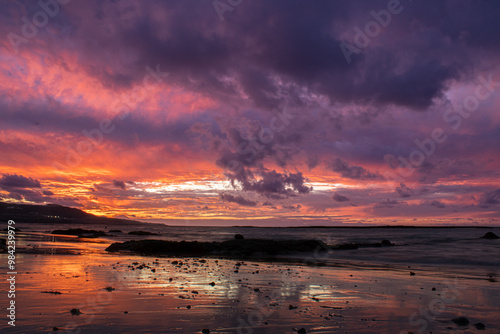 Sunset on the las palmas de gran canaria city beach, las canteras with mountain teide at background