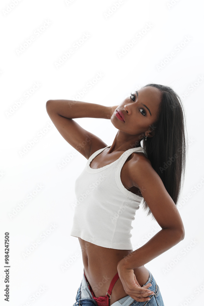 Young woman with dark skin posing over white background. Vertical. Young woman with dark skin posing over white background. Vertical.
