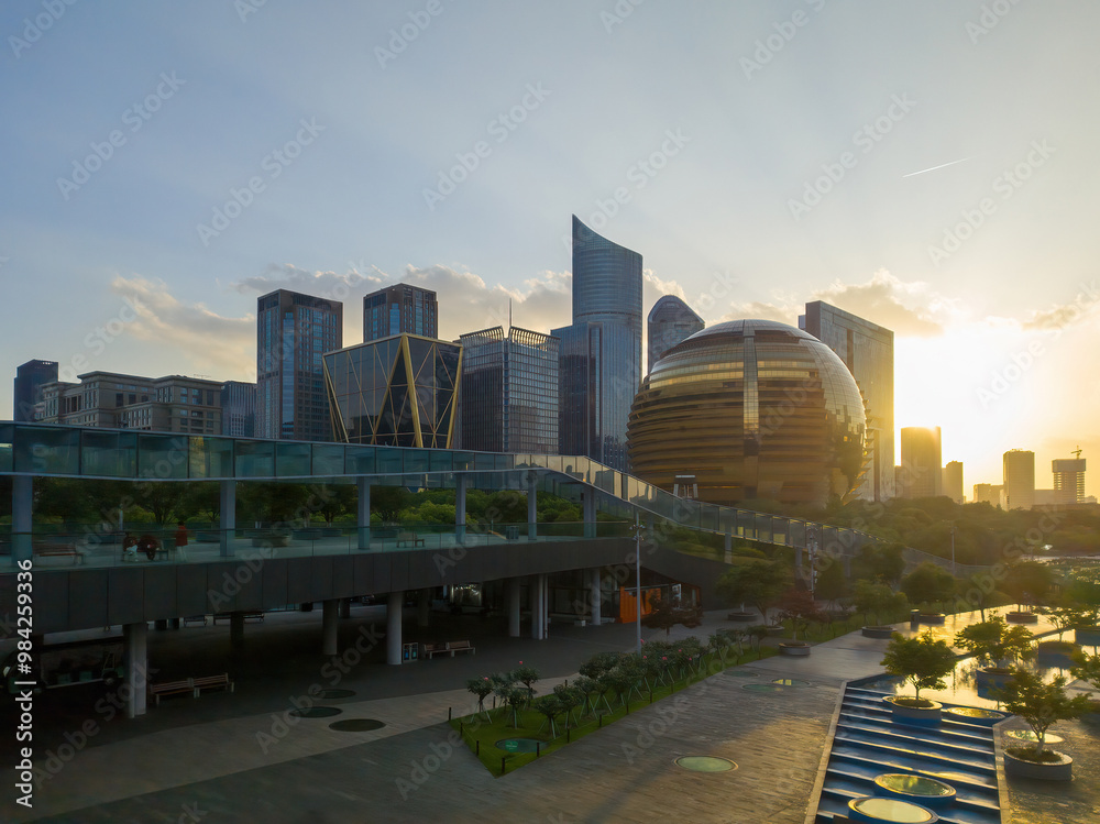 Fototapeta premium Modern City Skyline at Sunset with Architectural Marvels