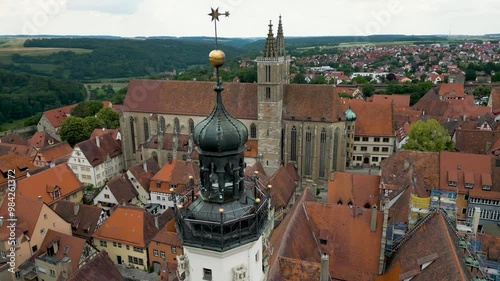 4K Aerial Drone Video of the Iconic Gothic St. Jakobskirche Church and Historic Town Hall Tower on the Market Square of Rothenburg, Germany photo