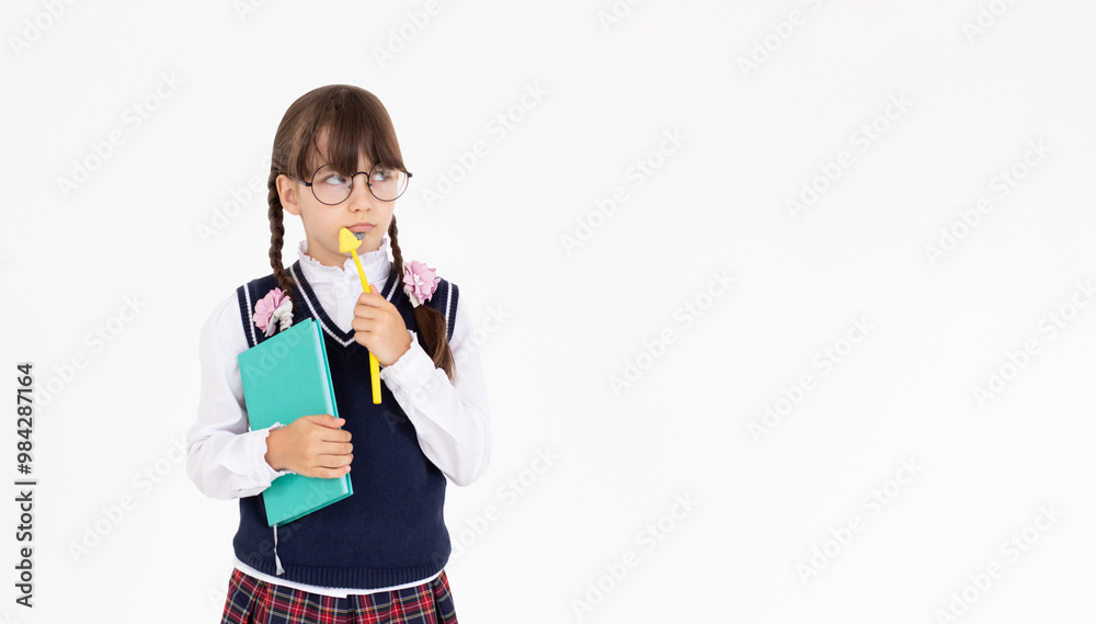 Thoughtful deciding schoolgirl in glasses with backpack, pen and notepad, preteen kid thinking looking at copy space having question. Kid student standing isolated on white background Thoughtful deciding schoolgirl in glasses with backpack, pen and notepad, preteen kid thinking looking at copy space having question. Kid student standing isolated on white background