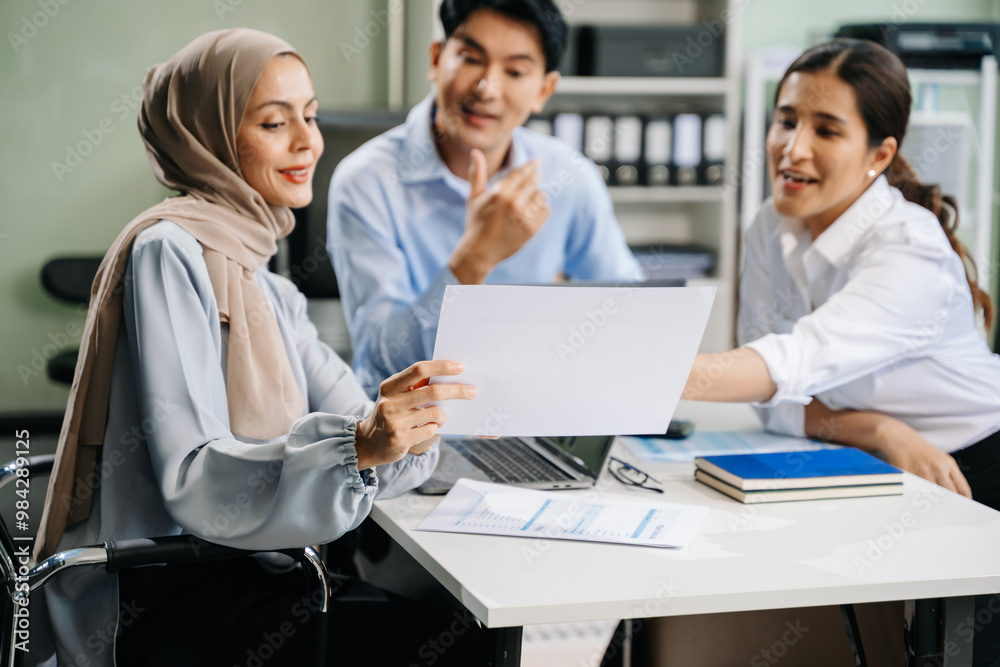 Happy businesspeople while collaborating on a new project in an office. Happy businesspeople while collaborating on a new project in an office.