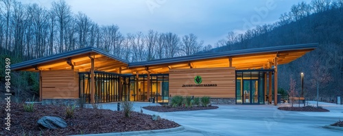 A trailhead visitor center with eco-friendly James Hardie siding, serving as the gateway to mountain hiking paths, designed to blend with the natural park surroundings