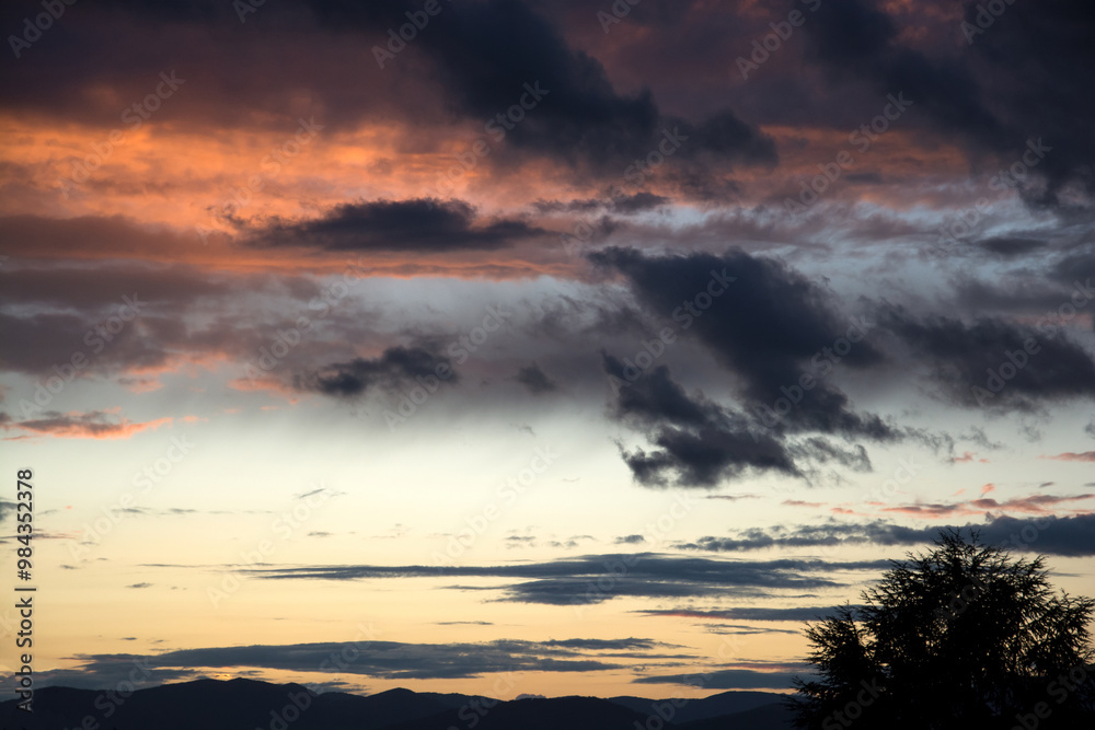 closeup of beautiful colorful sunset with clouds closeup of beautiful colorful sunset with clouds
