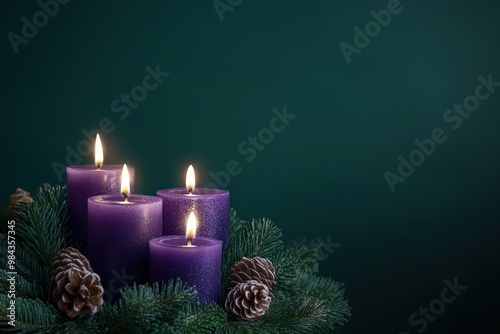 Purple Candles in a Christmas Wreath with Pine Cones photo