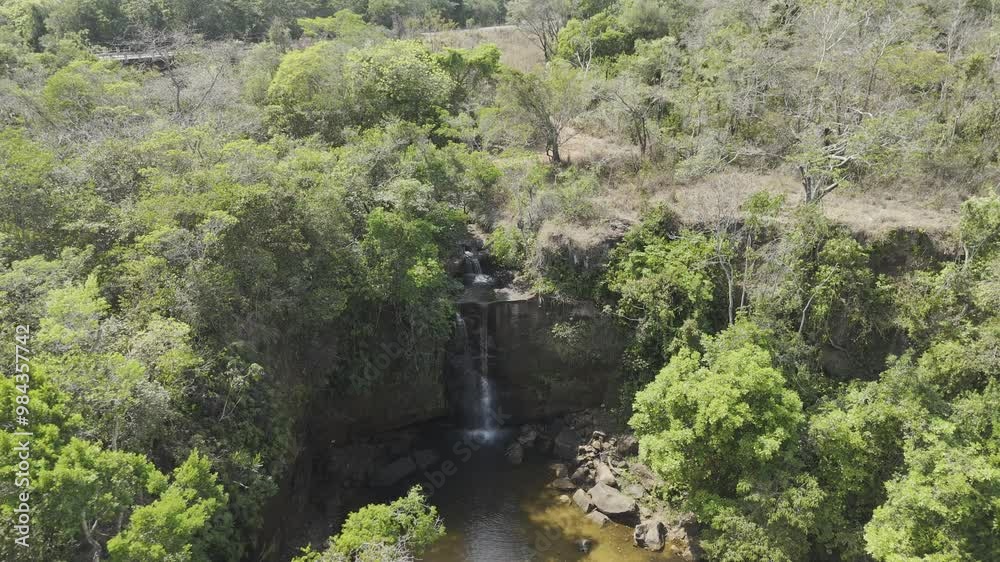 Drone pans down over Cachoeirinha waterfall in the Parque Nacional da Chapada dos Guimarães Drone pans down over Cachoeirinha waterfall in the Parque Nacional da Chapada dos Guimarães