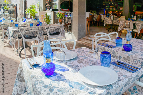 Open Air Caffee in Puerto de Mogan At Gran Canaria in Spain as Favorite Tourist and Vacation Place on The Island with Lots of Bougainvillea Flowers.