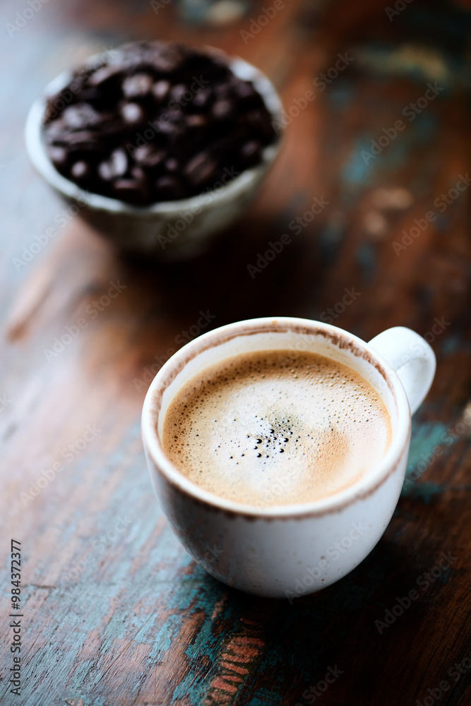 Cup of coffee on wooden background. Close up.	