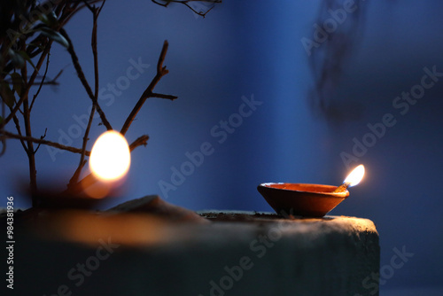 A radiant Diwali diya flickers brightly, symbolizing hope, joy, and the triumph of light over darkness. photo