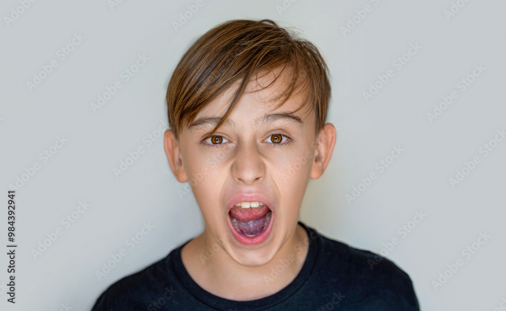 Scream. Child with angry expression. Shocked panic kid boy, screaming in despair, frustration.Young angry boy yelling. Little boy kid crazy and mad shouting and yelling with aggressive expression Scream. Child with angry expression. Shocked panic kid boy, screaming in despair, frustration.Young angry boy yelling. Little boy kid crazy and mad shouting and yelling with aggressive expression
