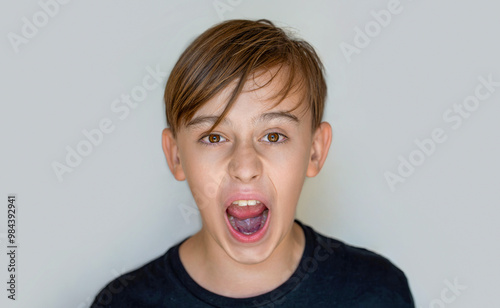 Scream. Child with angry expression. Shocked panic kid boy, screaming in despair, frustration.Young angry boy yelling. Little boy kid crazy and mad shouting and yelling with aggressive expression