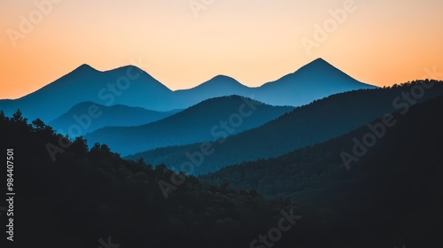 Majestic mountains silhouetted against the setting sun