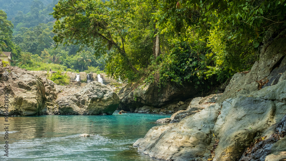 beautiful and exotic river views with clear blue water and large rocky hills, with a backdrop of tropical forests and water dams left over from the ancient Dutch era in Indonesia beautiful and exotic river views with clear blue water and large rocky hills, with a backdrop of tropical forests and water dams left over from the ancient Dutch era in Indonesia