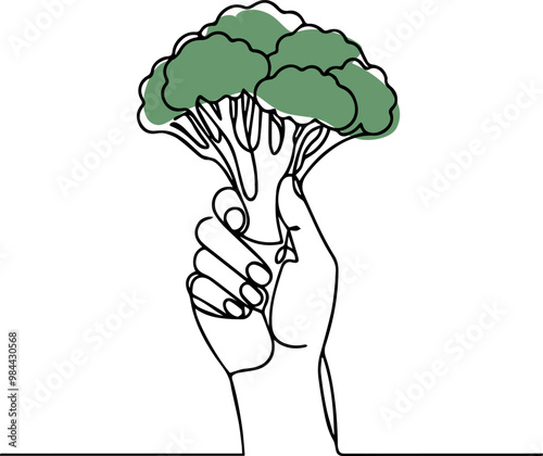 hand holding broccoli