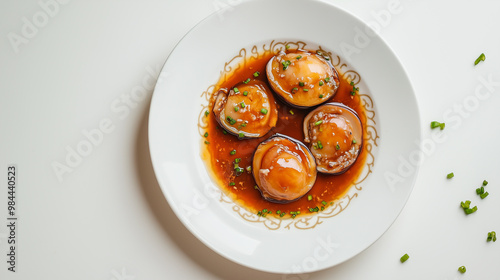 Wallpaper Mural Delicious Abalone in Sauce Served on a White Plate with Chinese Pattern
 Torontodigital.ca