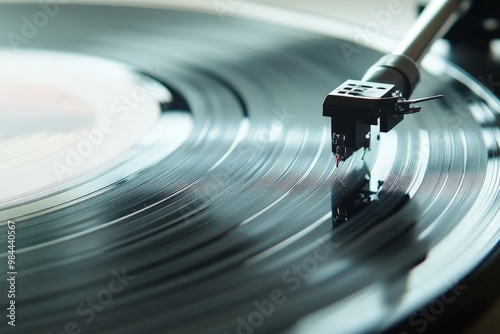 Detailed focused shot of a turntable needle tracing the grooves of a spinning vinyl record, signifying the pure analog joy and warmth of classical music experiences. photo