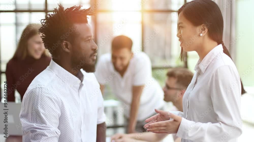 Business people in an open space office interior with a panoramic window Business people in an open space office interior with a panoramic window