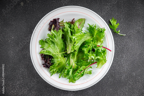 salad green leaves mix salad fresh meal food snack on the table copy space food background rustic top view keto or paleo diet vegetarian vegan food