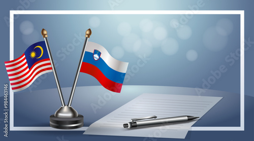 Malaysia and Slovenia Small national flag on bokeh background, cooperative relationship
