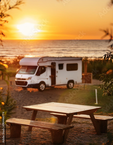 Wooden table in blurred motorhome camper tent at sunset on the beach , coast near the sea. Cool and relaxing concept. For product display montage or key visual layout design. space for text