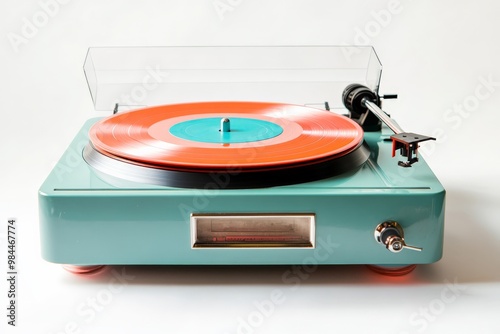 A stylish retro record player in teal with a clear cover, spinning a bright vinyl record. Ideal for collectors who love vintage aesthetics and quality sound. photo