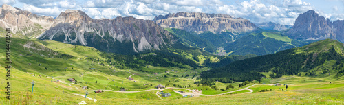 panoramic view of rocky mountain and blanket-like grass covered valley in summer, Seceda, Dolomites, Italy