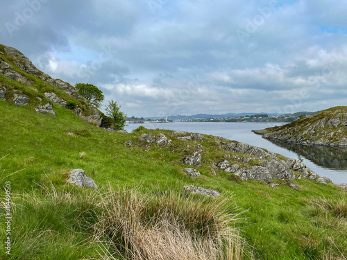 Panorama of the beautiful landscape of the island of Karmoy in Rogaland, Norway, with dark cloudy sky