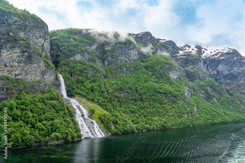 Beautiful waterfall called The Suitor which is opposite the Seven Sisters waterfalls in Geiranger Fjord, Norway