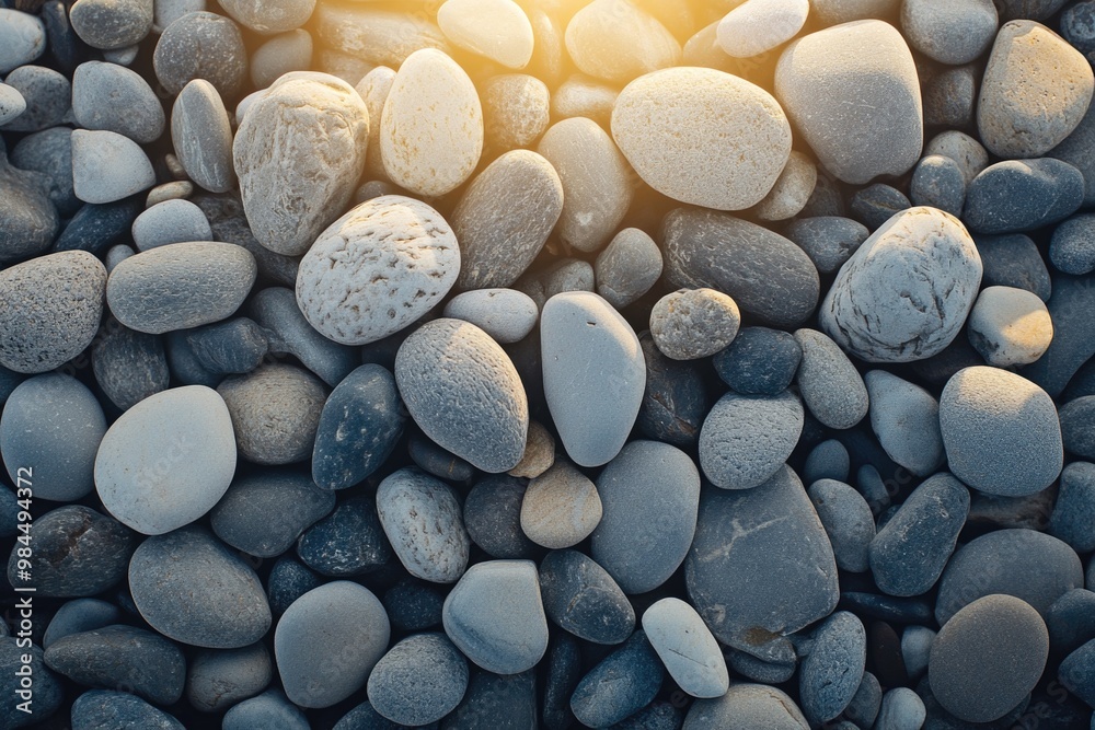 A top view of small pebbles on the beach. A top view of small pebbles on the beach.
