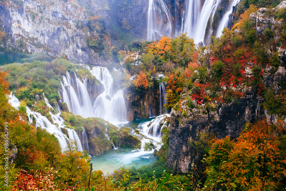 Scenic Autumn Waterfall in Serene Forest Setting