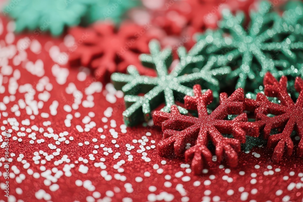 Snowflakes falling in a red and green-themed Christmas backdrop, capturing the essence of the season Snowflakes falling in a red and green-themed Christmas backdrop, capturing the essence of the season