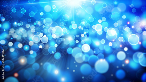 Blue abstract bokeh background with radiant light and circles, copy space