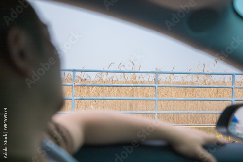 Chongming District, Shanghai - Side view of people sitting in a car photo