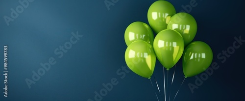 Bright chartreuse balloons on a deep indigo background, providing a bold and dynamic contrast.