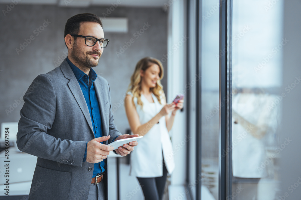 Confident Business Professionals Collaborating in a Modern Office Confident Business Professionals Collaborating in a Modern Office