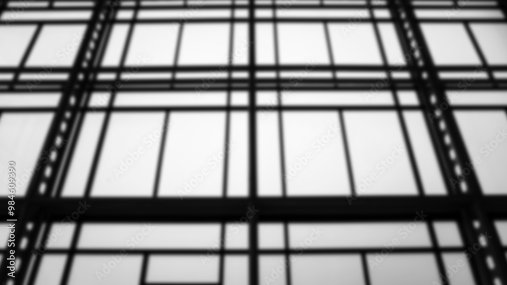 Black and white blurred image of the structure and glass of an office building.. Black and white blurred image of the structure and glass of an office building..